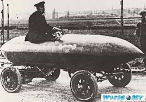 In the picture is Jenatzy "La Jamais Contente", first automobile to reach 100 km/h in 1899